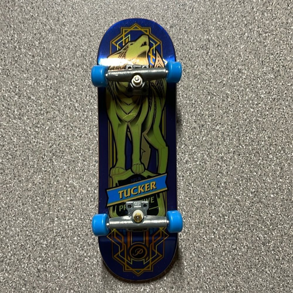 Tech Deck Mini Skateboard featuring Nick Tucker and a‎ unique wolf design.